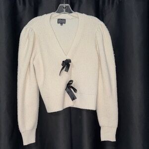 Chic Cream Cardigan with Black Bow Accents